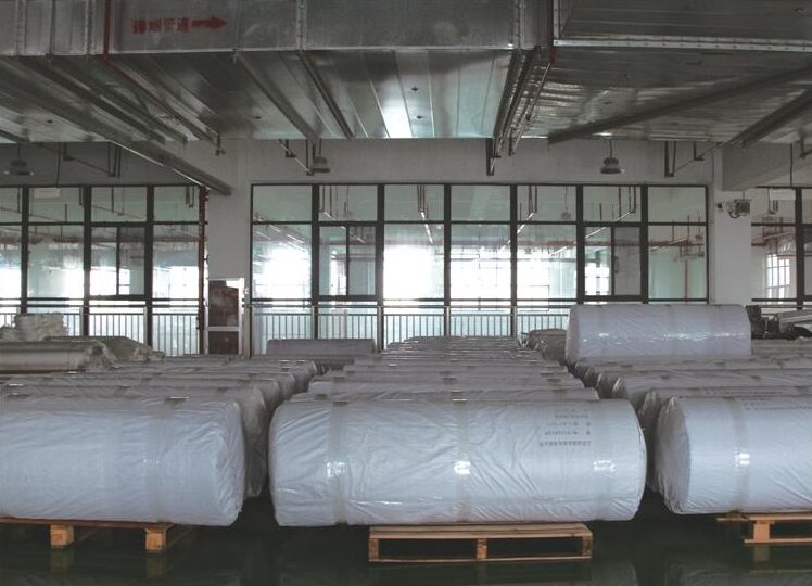 Wrapped rolls staged for packaging
